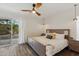 Main bedroom with sliding door to patio and ceiling fan at 5960 E Pershing Ave, Scottsdale, AZ 85254