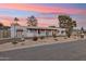 Front view of a remodeled mid-century modern home at sunset at 5960 E Pershing Ave, Scottsdale, AZ 85254