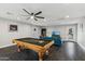 Game room with pool table, seating area, and large TV at 5960 E Pershing Ave, Scottsdale, AZ 85254