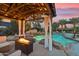 Relaxing patio with fire pit and pool views at 5960 E Pershing Ave, Scottsdale, AZ 85254