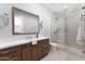 Spa-like bathroom with walk-in shower, marble vanity, and modern fixtures at 601 E Amber Sun Dr, Phoenix, AZ 85085