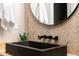 Bathroom with black vessel sink and geometric tile backsplash at 601 E Amber Sun Dr, Phoenix, AZ 85085