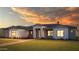 Stunning modern farmhouse exterior at sunset at 604 E Amber Sun Dr, Phoenix, AZ 85085