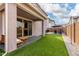 Covered patio, artificial turf, and seating area at 646 S Jacana Ln, Gilbert, AZ 85296