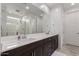 Modern bathroom with double vanity and large mirror at 646 S Jacana Ln, Gilbert, AZ 85296