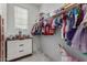 Well-organized closet with clothing and toys at 646 S Jacana Ln, Gilbert, AZ 85296