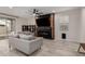 Living room with gray sectional sofa, fireplace, and built-in shelving at 646 S Jacana Ln, Gilbert, AZ 85296