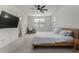 Main bedroom with ceiling fan, large window, and hardwood floors at 646 S Jacana Ln, Gilbert, AZ 85296