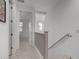 Upstairs hallway with access to bedrooms and stairs at 646 S Jacana Ln, Gilbert, AZ 85296