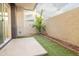 Private backyard with artificial turf and a small tree at 6850 E Mcdowell Rd # 7, Scottsdale, AZ 85257