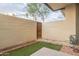 Small backyard with artificial turf and a block wall at 6850 E Mcdowell Rd # 7, Scottsdale, AZ 85257