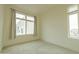 Bright bedroom with large window, carpet flooring, and ample closet space at 6850 E Mcdowell Rd # 7, Scottsdale, AZ 85257