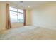 Bright bedroom with large window and plush carpeting at 6850 E Mcdowell Rd # 7, Scottsdale, AZ 85257