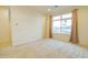 Bedroom with window, view and access to hallway at 6850 E Mcdowell Rd # 7, Scottsdale, AZ 85257