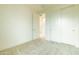 Spacious bedroom with sliding closet doors and hallway access at 6850 E Mcdowell Rd # 7, Scottsdale, AZ 85257