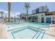 Inviting resort-style pool and spa with ample lounge chairs and umbrellas at 6850 E Mcdowell Rd # 7, Scottsdale, AZ 85257