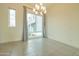 Bright dining area with large window and chandelier at 6850 E Mcdowell Rd # 7, Scottsdale, AZ 85257