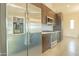 Modern kitchen features stainless steel appliances and dark wood cabinets at 6850 E Mcdowell Rd # 7, Scottsdale, AZ 85257