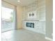 Living room with a modern fireplace and built-in shelving at 6850 E Mcdowell Rd # 7, Scottsdale, AZ 85257