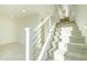 Modern staircase with white railing and carpeted steps at 6850 E Mcdowell Rd # 7, Scottsdale, AZ 85257