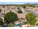 Aerial view showcasing the home and pool with surrounding neighborhood at 7167 W Trails Dr, Glendale, AZ 85308