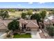 Single-story home with tile roof, landscaped yard, and driveway at 7167 W Trails Dr, Glendale, AZ 85308