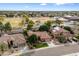 House with a large yard and neighborhood in background at 7167 W Trails Dr, Glendale, AZ 85308