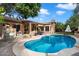 Inviting kidney-shaped pool with patio and built-in BBQ at 7167 W Trails Dr, Glendale, AZ 85308