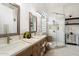 Elegant bathroom featuring a walk-in shower and double vanity at 7167 W Trails Dr, Glendale, AZ 85308