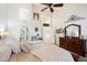 Bright bedroom with ensuite bathroom access and a comfortable bed at 7167 W Trails Dr, Glendale, AZ 85308