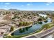 Wide shot of a lakefront community with mountains in the distance at 7167 W Trails Dr, Glendale, AZ 85308