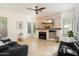 Gathering room with fireplace, built-in shelving and large TV at 7167 W Trails Dr, Glendale, AZ 85308