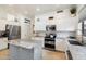 Modern kitchen featuring stainless steel appliances and ample counter space at 7167 W Trails Dr, Glendale, AZ 85308