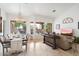 Open concept living space with a view of the backyard and pool at 7167 W Trails Dr, Glendale, AZ 85308