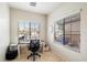 Bright home office with a desk and plenty of natural light at 7167 W Trails Dr, Glendale, AZ 85308