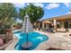 Relaxing pool area with patio furniture and umbrella at 7167 W Trails Dr, Glendale, AZ 85308