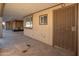 Covered patio with access door and exterior view at 7736 W Acoma Dr, Peoria, AZ 85381