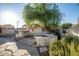 Outdoor patio with fire pit and built-in bar, perfect for entertaining at 7736 W Acoma Dr, Peoria, AZ 85381