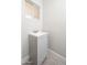 Clean bathroom featuring a gray vanity and tiled floor at 7736 W Acoma Dr, Peoria, AZ 85381