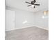 Spacious bedroom with ceiling fan and closet at 7736 W Acoma Dr, Peoria, AZ 85381