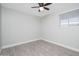 Cozy bedroom with ceiling fan and window blinds at 7736 W Acoma Dr, Peoria, AZ 85381