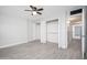 Light and airy bedroom with ceiling fan and closet at 7736 W Acoma Dr, Peoria, AZ 85381