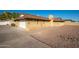 Brick home with attached garage and gravel landscaping at 7736 W Acoma Dr, Peoria, AZ 85381