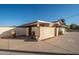 Backyard view showcasing a wall and access gate at 7736 W Acoma Dr, Peoria, AZ 85381