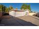 Detached garage with single door and gravel area at 7736 W Acoma Dr, Peoria, AZ 85381