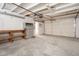 Attached garage with built-in shelving and overhead storage at 7736 W Acoma Dr, Peoria, AZ 85381