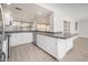 Kitchen with white cabinets and granite countertops at 7736 W Acoma Dr, Peoria, AZ 85381