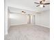 Spacious living room featuring tile floors and ceiling fans at 7736 W Acoma Dr, Peoria, AZ 85381