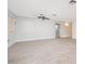 Spacious living room with tile floors and ceiling fan at 7736 W Acoma Dr, Peoria, AZ 85381