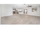 Open living room with kitchen view and tile floors at 7736 W Acoma Dr, Peoria, AZ 85381